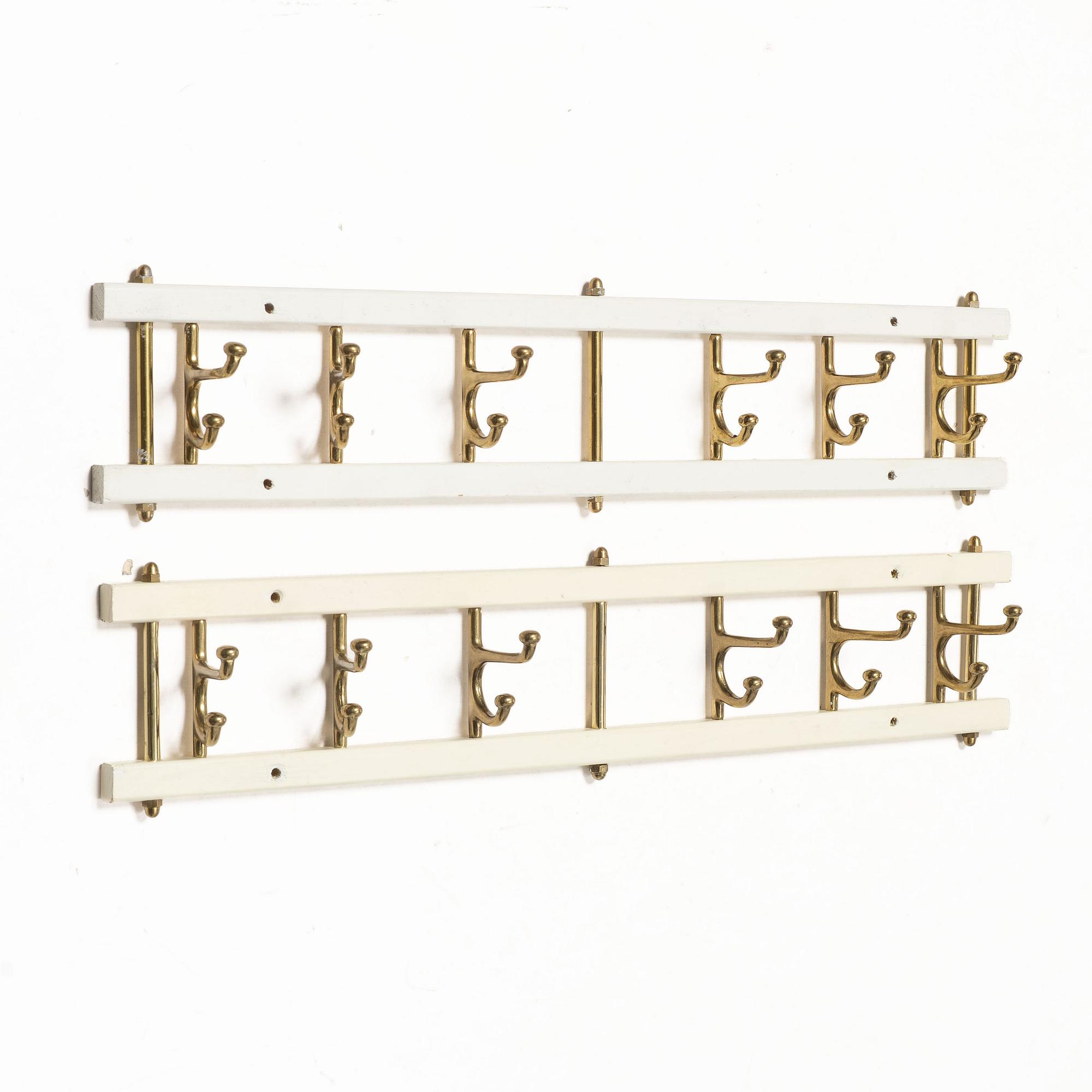 Coat hangers, a pair, “Dekorativ”, Skoglunds Metallgjuteri, Anderstorp, mid-20th century.