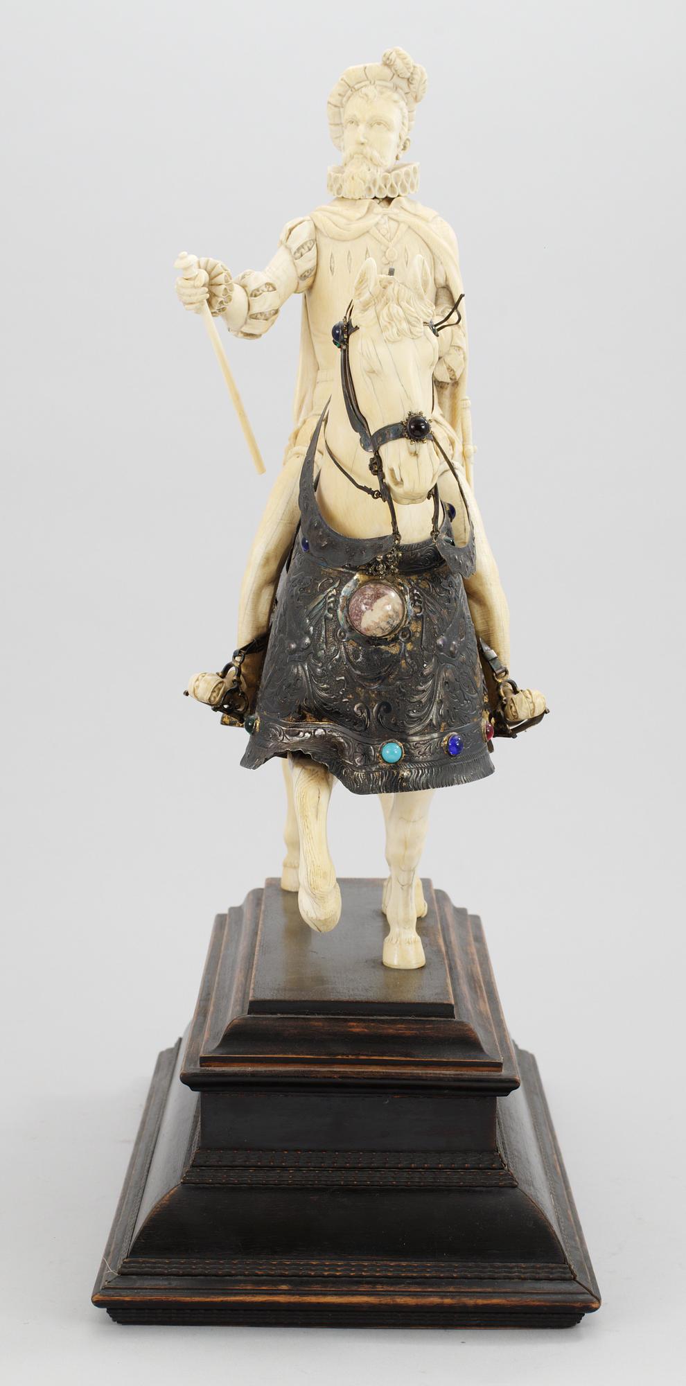 A late 19th century equestrian ivory, wood and metal statue.