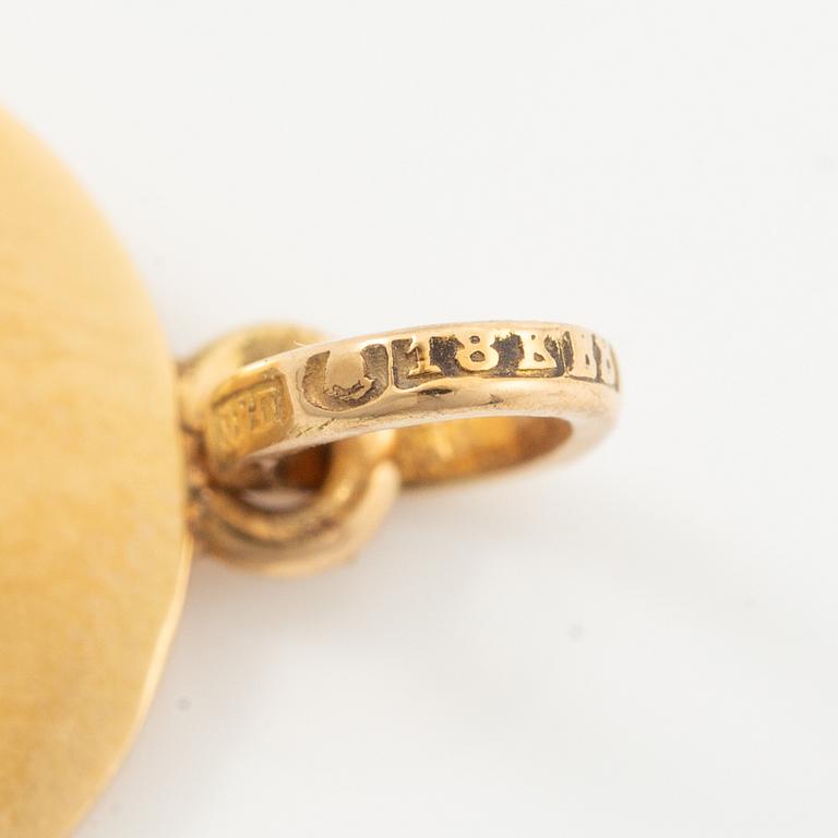 Two pendants in 18K gold and white gold.