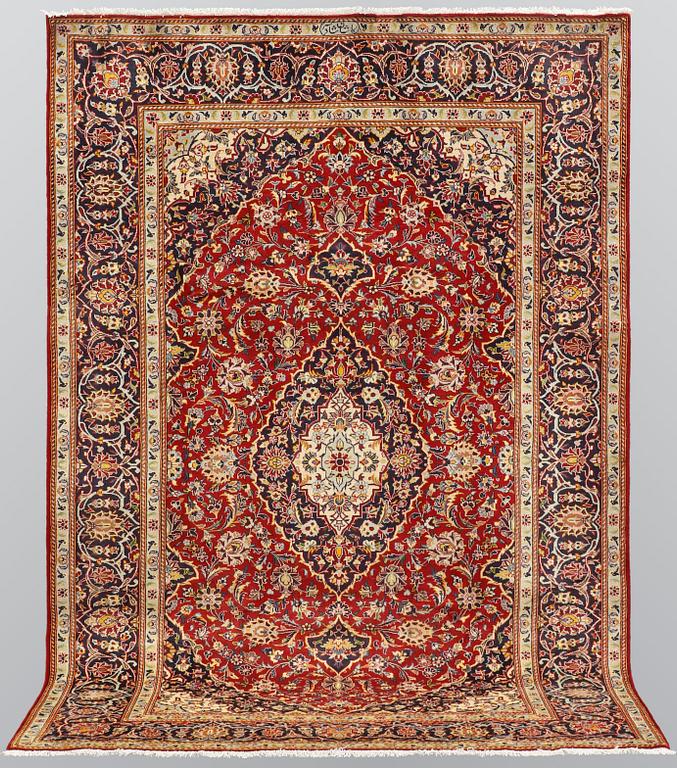 A carpet, Kashan, signed, ca 300 x 204 cm.