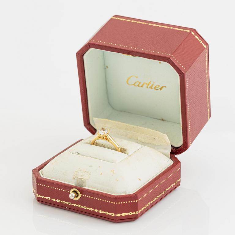 Cartier 18K gold and brilliant cut diamond solitaire ring.