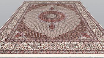 A part silk Moud carpet, approximately 350 x 252 cm.
