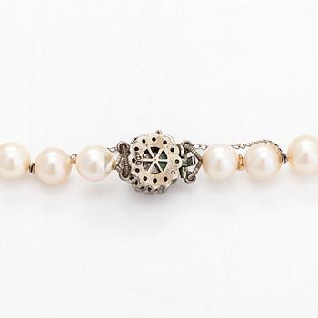 A cultured pearl necklace, clasp with white zircons.