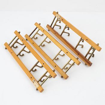 A group of three 'Dekorativ' coat hangers, Skoglunds metallgjuteri, Anderstorp, 1950's/60's.