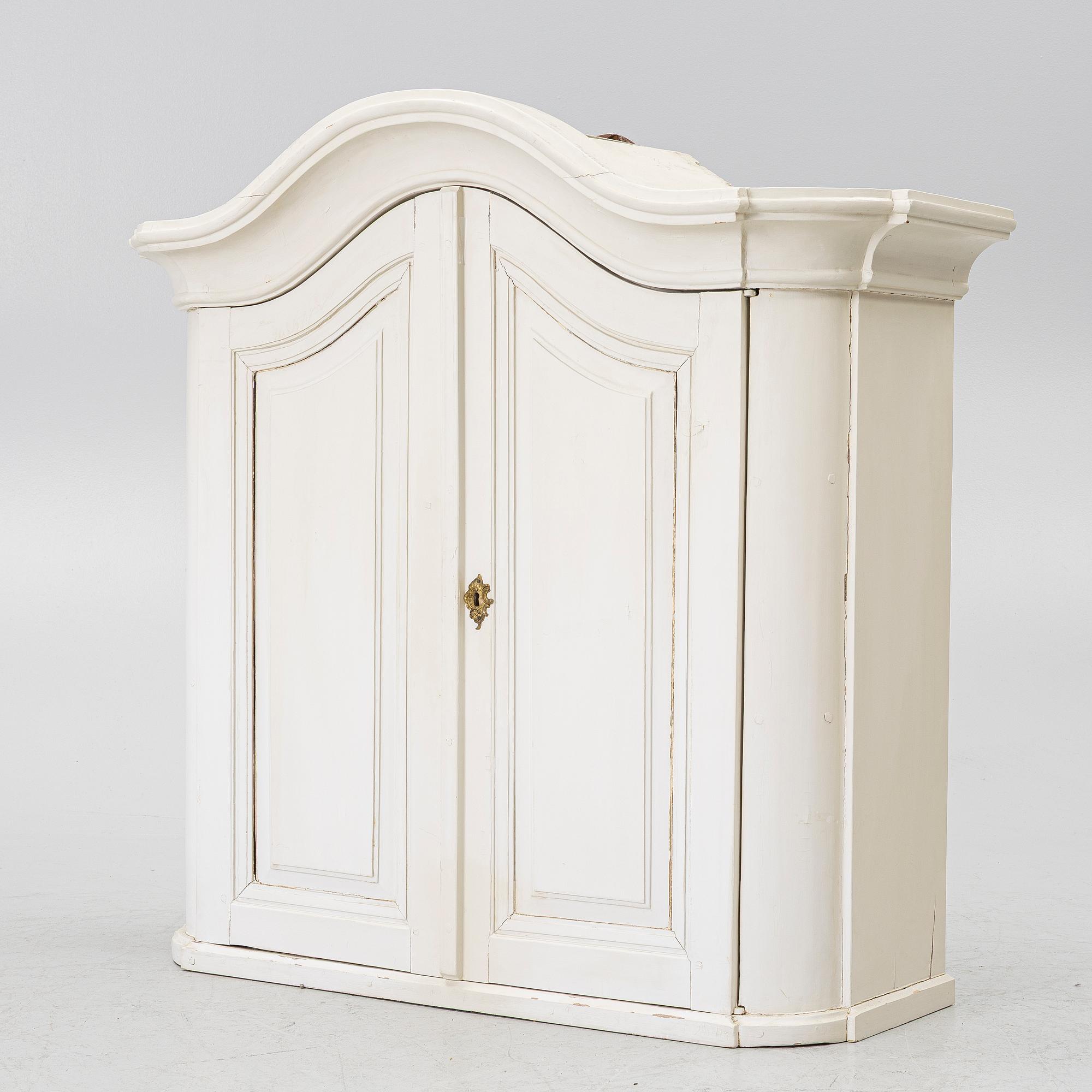 A Swedish rococo hanging cabinet, mid 18th century.