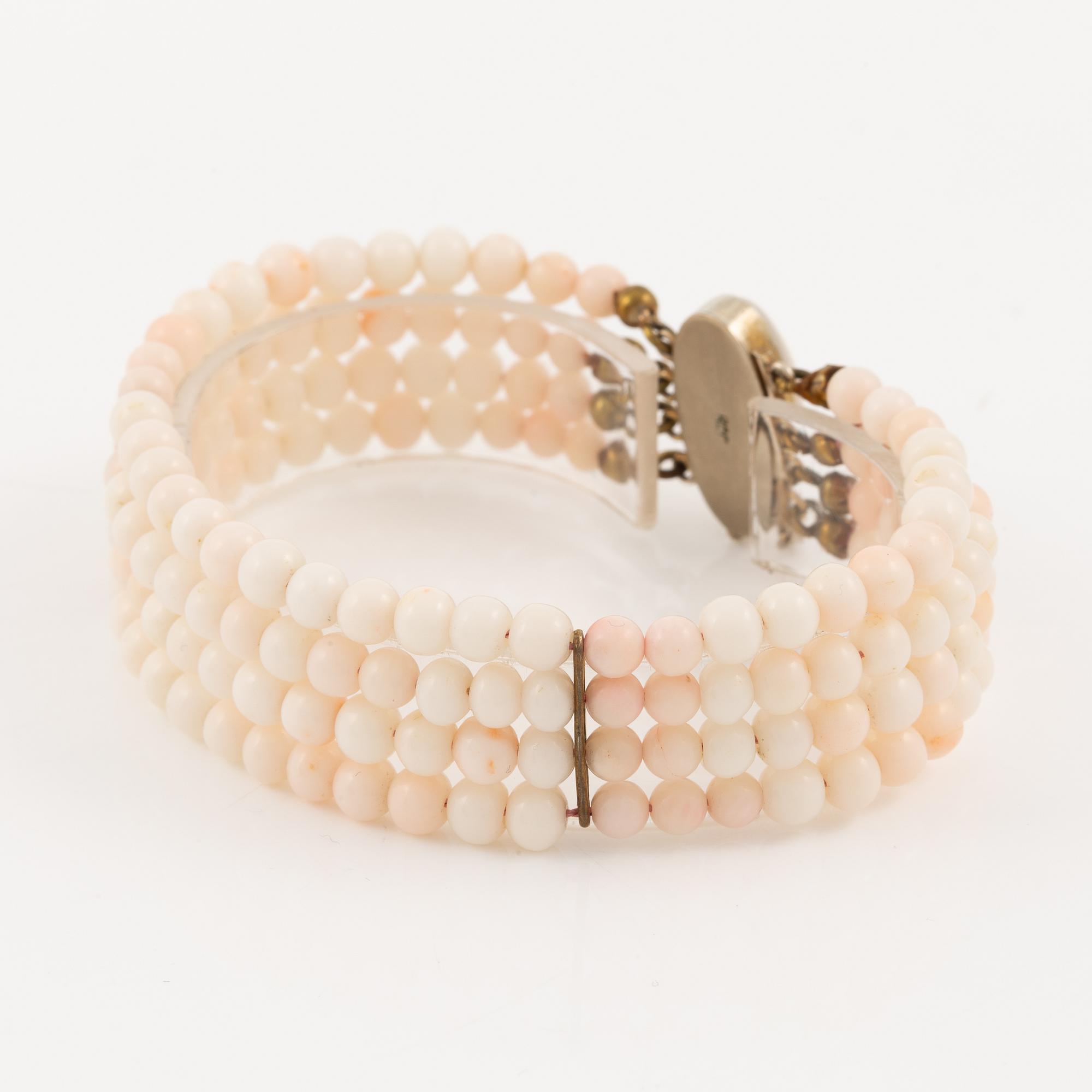 Bracelet with light pink coral, four strands.