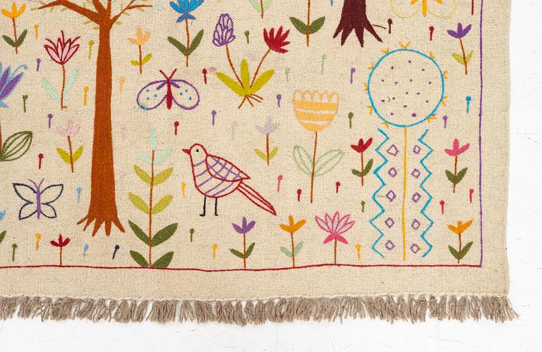 A hand-embroidered Kelim rug, c. 177 x 122 cm.