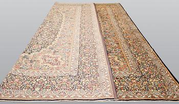 A Kirman Laver carpet, 'Millefleur', approx. 492 x 350 cm.