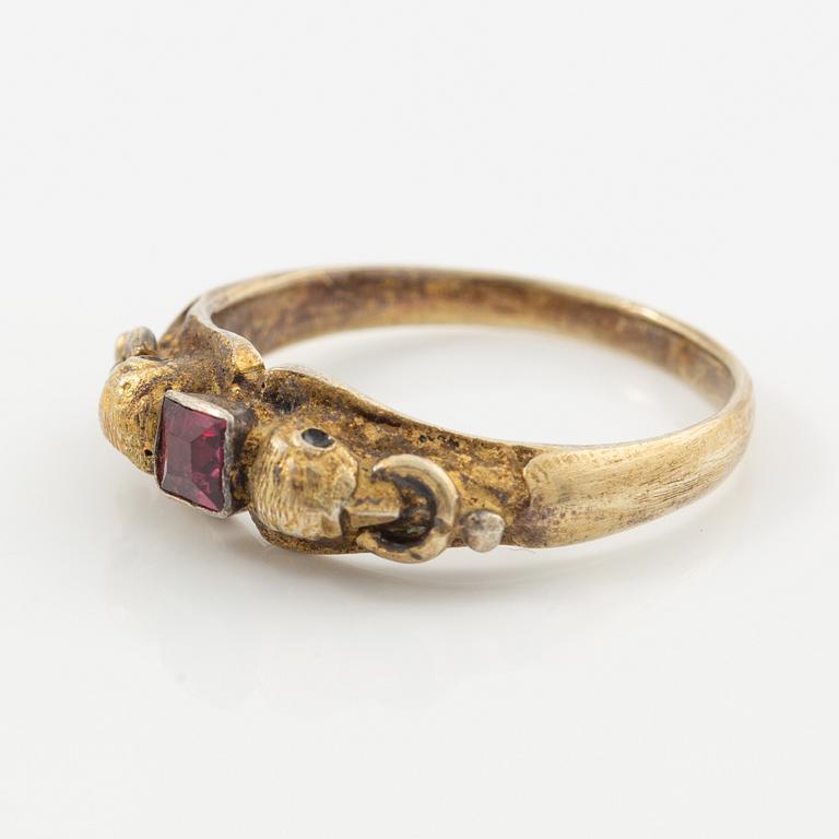 Two rings in silver with pink/red stones.