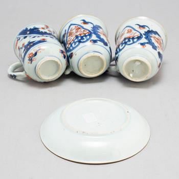 A pair of imari cups and a cup and saucer, Qing dynasty, 18th century.