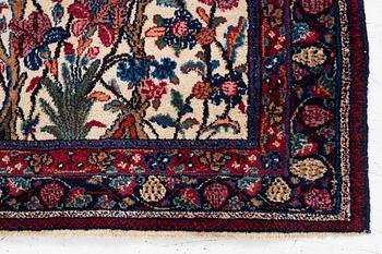 A semi-antique Meshad rug, signed, approx. 133 x 85 cm.