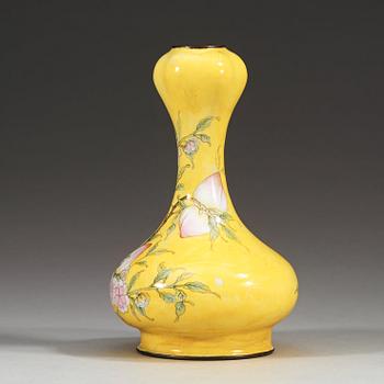 A yellow enamel on copper vase, Qing dynasty (1644-1912), with Qianlong four character mark.