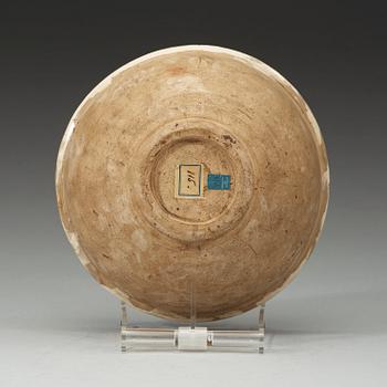 A marbled on white slip-glazed earthenware bowl, Song dynasty (960-1279).
