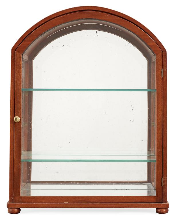 A Josef Frank mahogany showcase cabinet by Svenskt Tenn, model 2070.