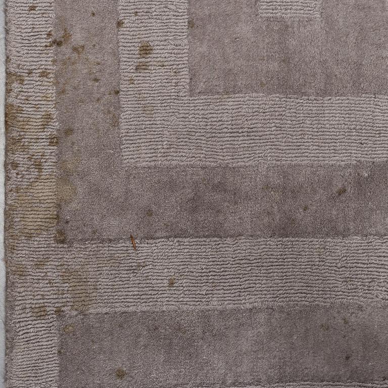 A Layered "Wool Cubes" carpet, 390x620 cm.