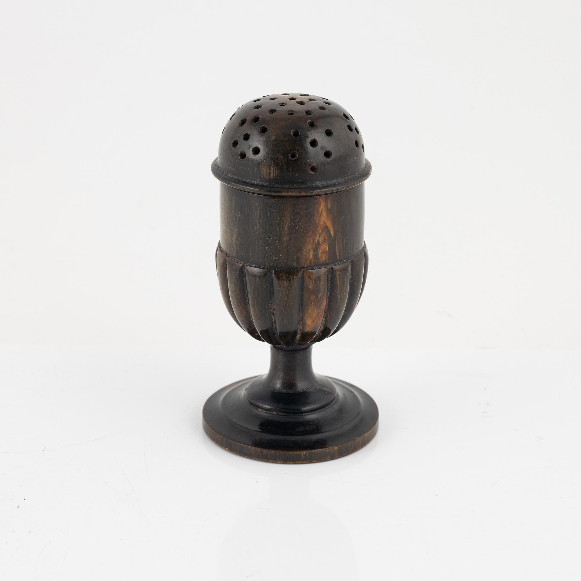 A 18th Century horn saltshaker.