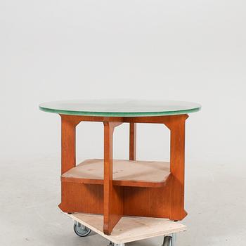 A 1940s wood and glass coffee table.