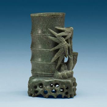 1411. A green stone brush pot, China, 20th Century.