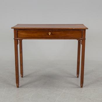 In the manner of the artist, a early 19th century late Gustavian table veneered with mahogany.