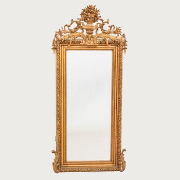 A Neo Rococo bronzed mirror around 1900.