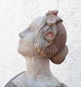 A WOODEN FIGURE- HEAD,