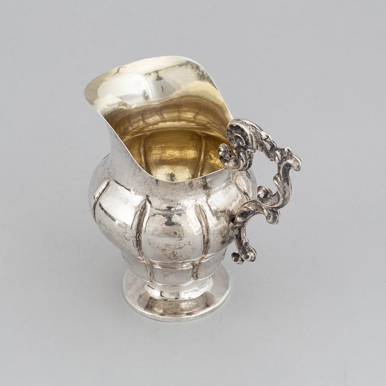 A Swedish 19th century parcel-gilt silver cream-jug, mark of Oskar Ahlström, Södertälje 1856.