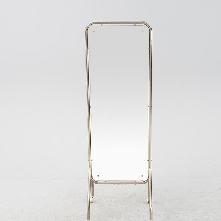 A mid 20th Century floor mirror on wheels.