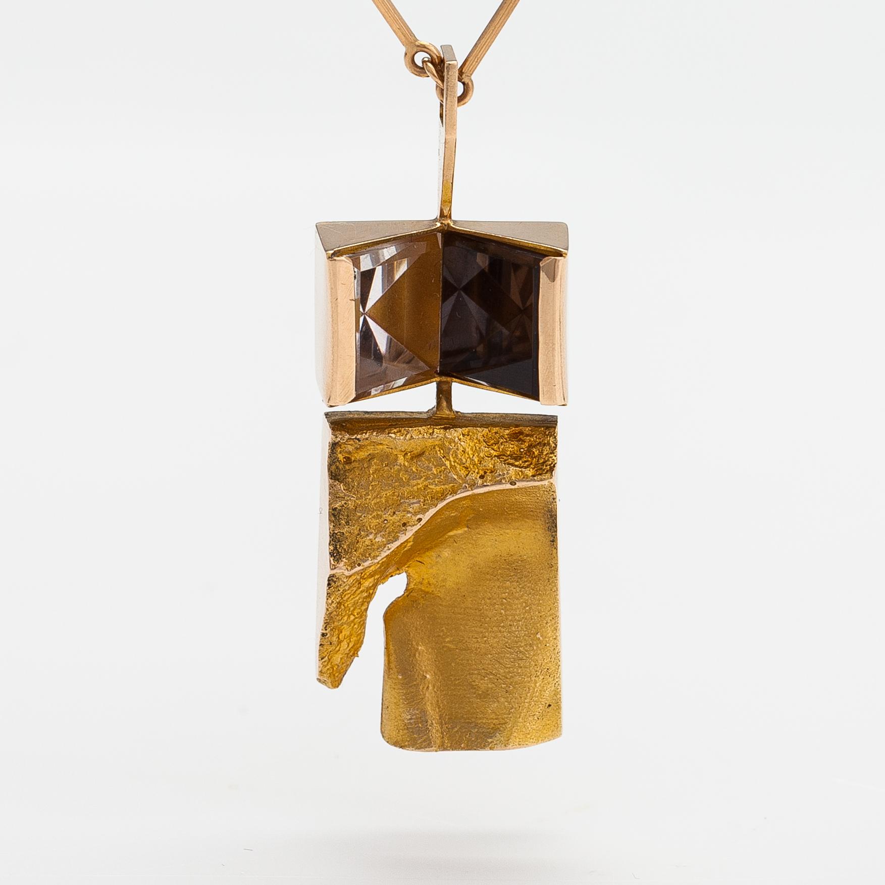 Björn Weckström, "Narcissos", a 14K gold pendant with a smoaky quartz and a rock crystal. Lapponia 1965.