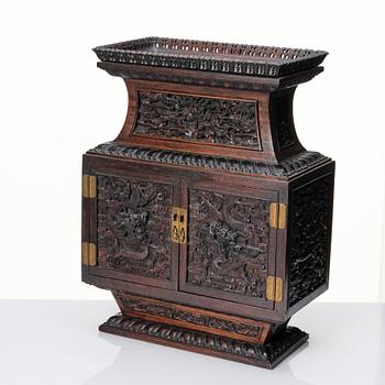 A hardwood dragon cabinet, Qing dynasty 18/19th Century.