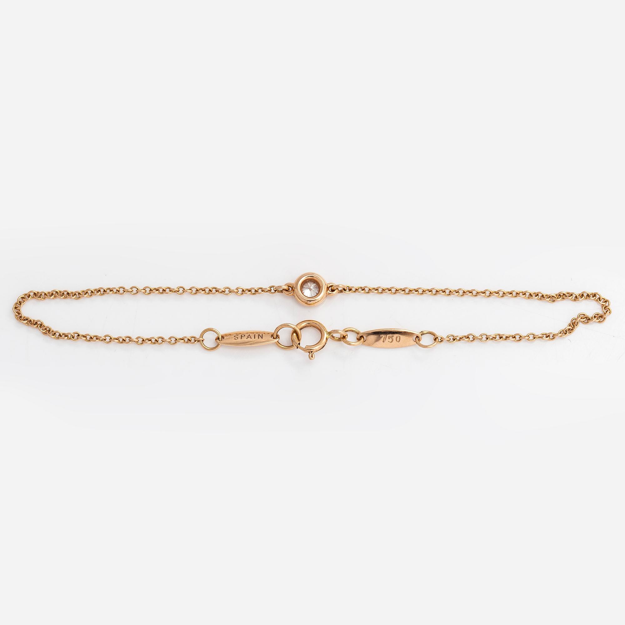 Tiffany & Co, Elsa Peretti, an 18K gold bracelet with a brilliant cut diamond ca 0.07 ct.