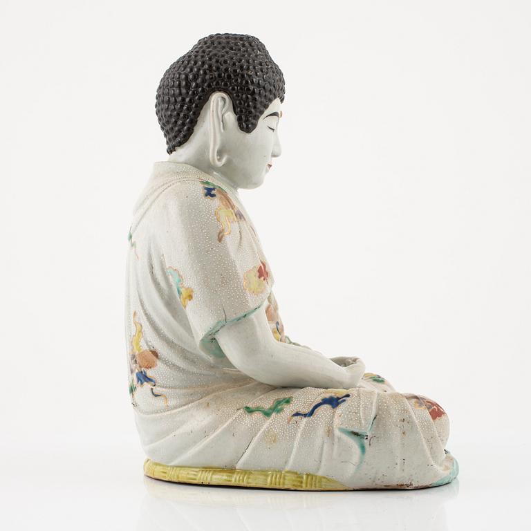 A porcelain buddha, Japan, 20th century.