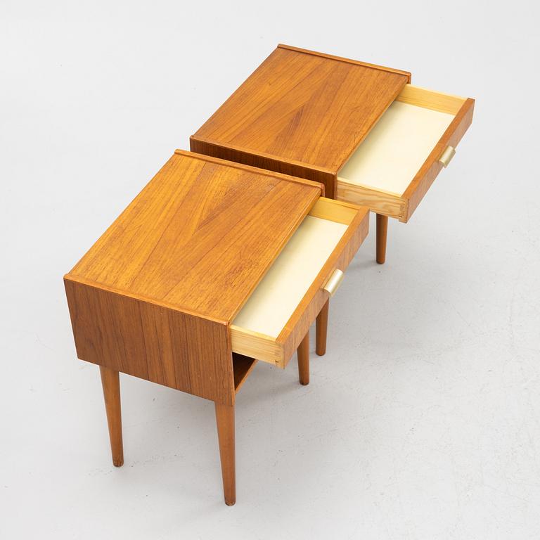A pair of teak veneered bedside tables, second half of the 20th Century.