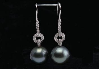 A PAIR OF EARRINGS, Tahitian pearls 13 mm, brilliant cut diamonds c. 0.25 ct. 18K white gold. Weight 8,7 g.