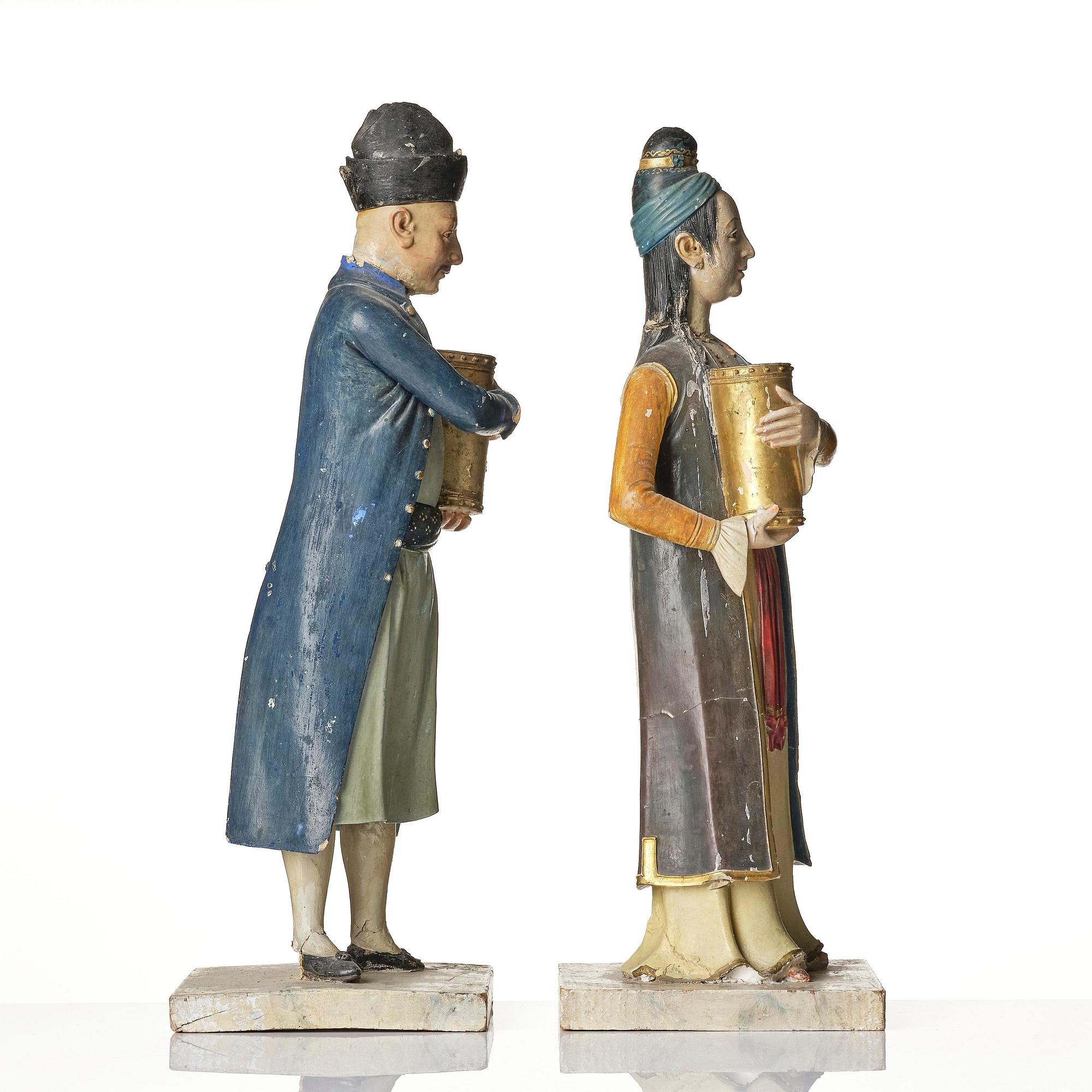 A pair of Chinoiserie figures of a Parsi tradesman and his wife, Qing dynasty, Canton, 19th century.