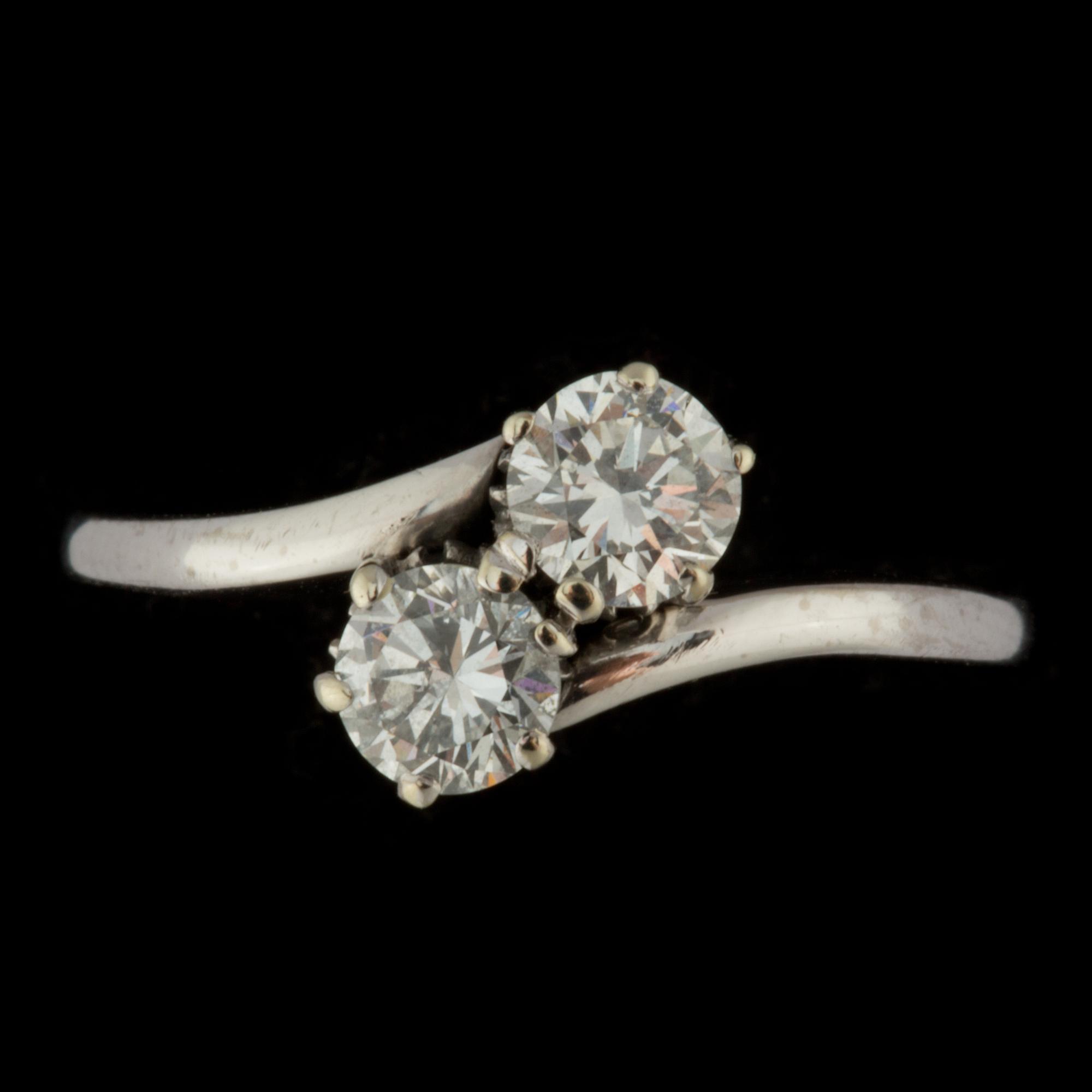 RING, 18 k vitguld med 2 briljantslipade diamanter, totalt 0,75ct, Stockholm, 1954. Vikt ca 2 g.
