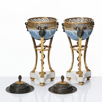 A pair of gilt bronze, marble and ceramic potpourri urns with covers, 19th century.