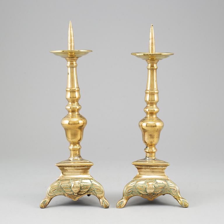 A  pair of 17th century bronze candlesticks.