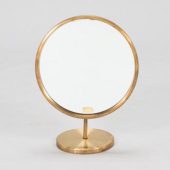 A brass table mirror, Glas Mäster, Markaryd, Sweden.