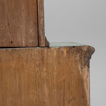 A 18th century corner cabinet.