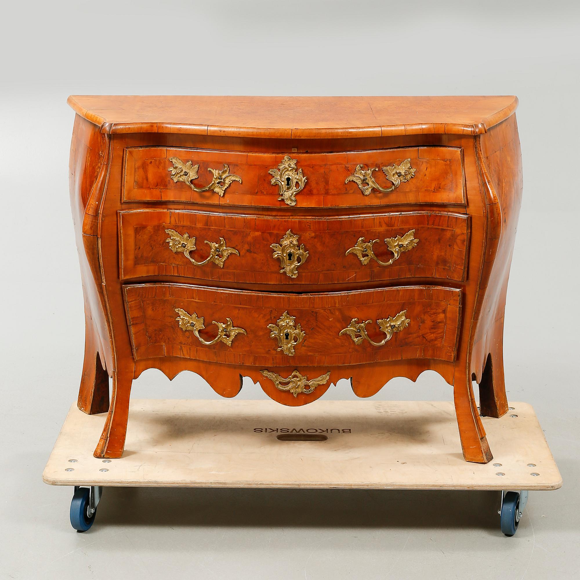 A Rococo bureau from the 18th century.