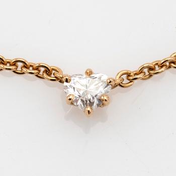 Necklace, 18K gold with heart-shaped diamond.