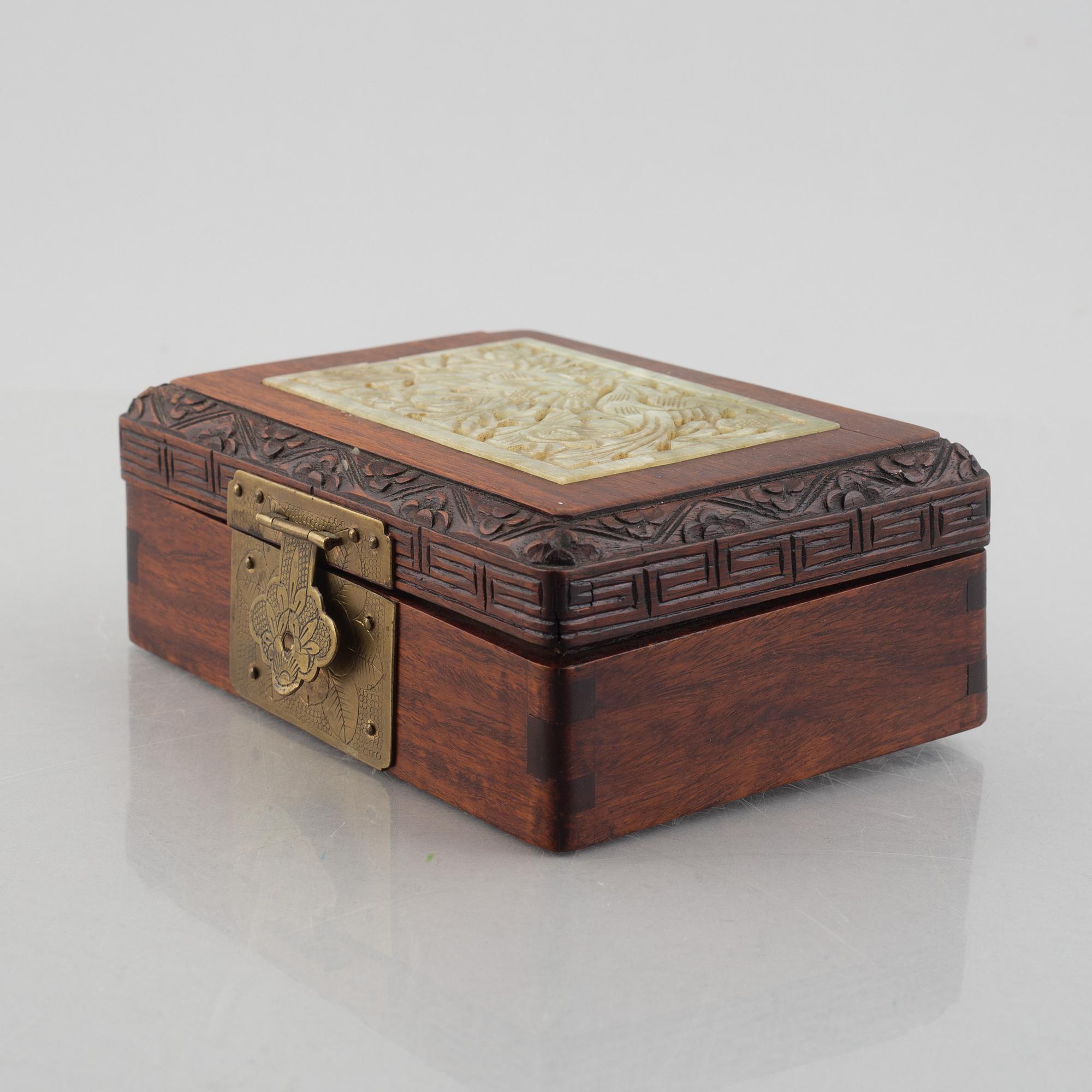 Two Chinese hardwood boxes with nephrite plaques, 20th century.