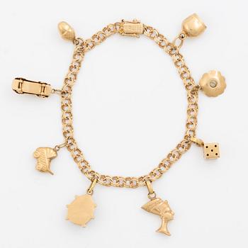 Bracelet, 18K gold bismarck link. With charms.