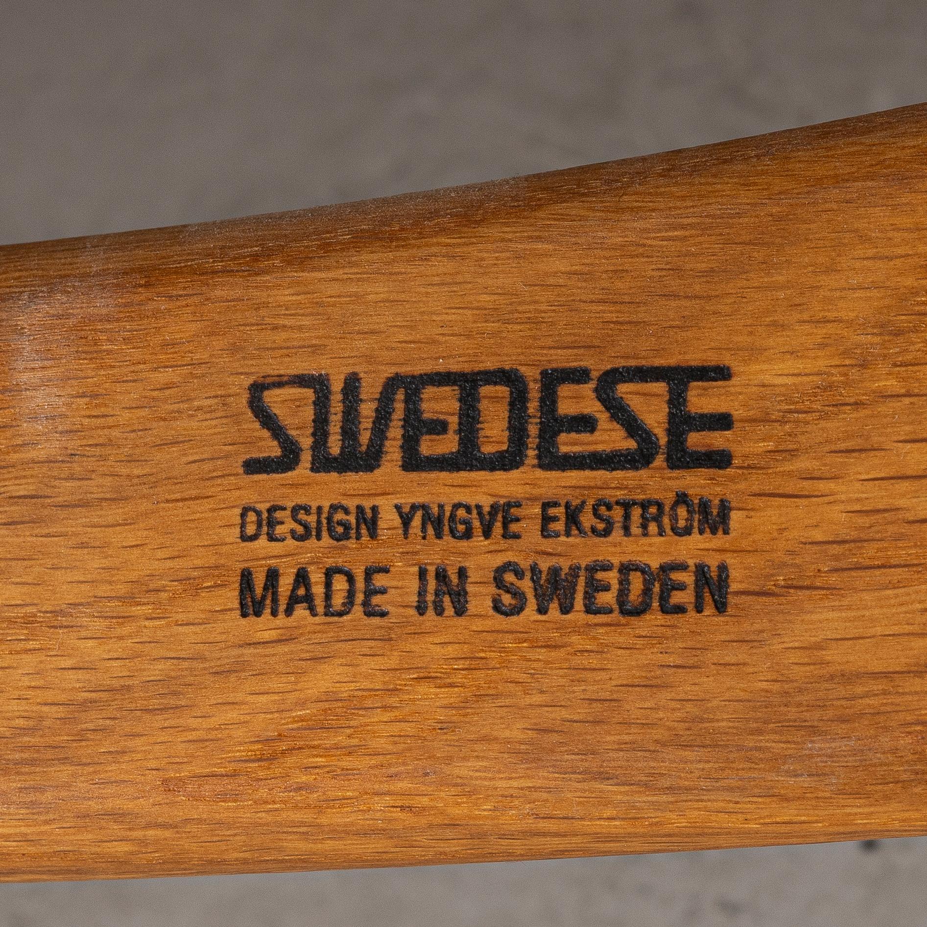 Yngve Ekström, a 'Lamino' armchair and sidetable, Swedese, Sweden, early 21st century.