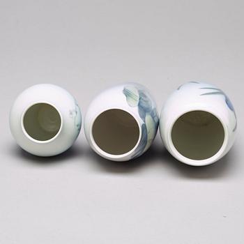 BING & GRÖNDAHL and ROYAL COPENHAGEN, a set of three porcelain vases and a dish, Denmark.