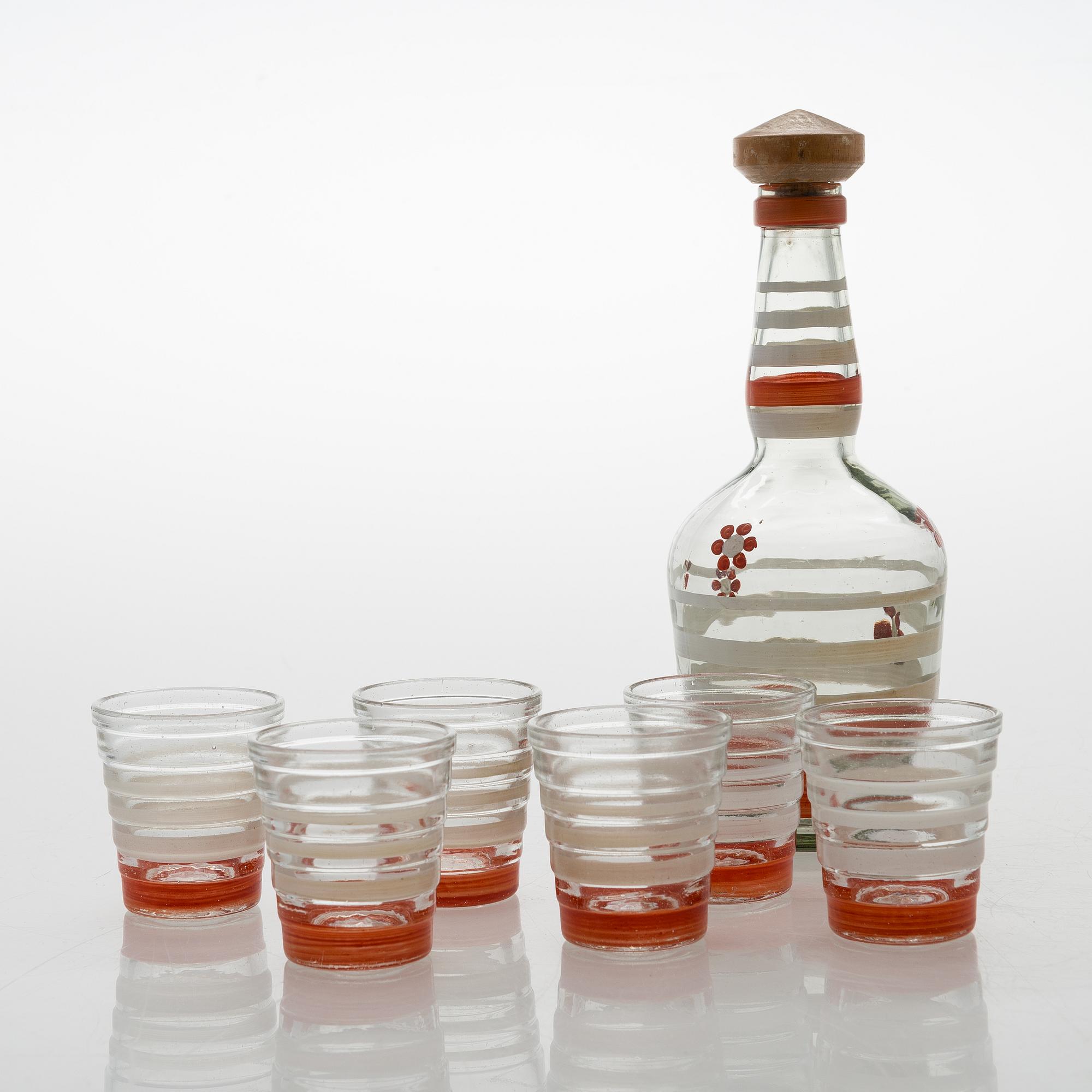 A set of 6 snapsglasses and a bottle designed by Aino Aalto for Karhula in the 1930-1940's.