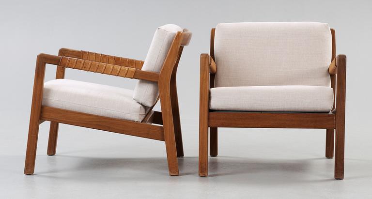 A pair of Carl Gustaf Hiort af Ornäs walnut armchairs, Finland 1950's.