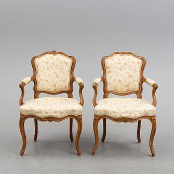 A pair of 18th century armchairs.