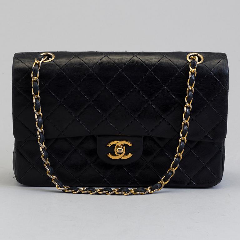 CHANEL, a black leather shoulder bag, "Double Flap".