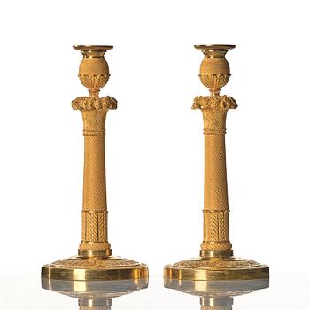 A pair of Empire early 19th century candlesticks.